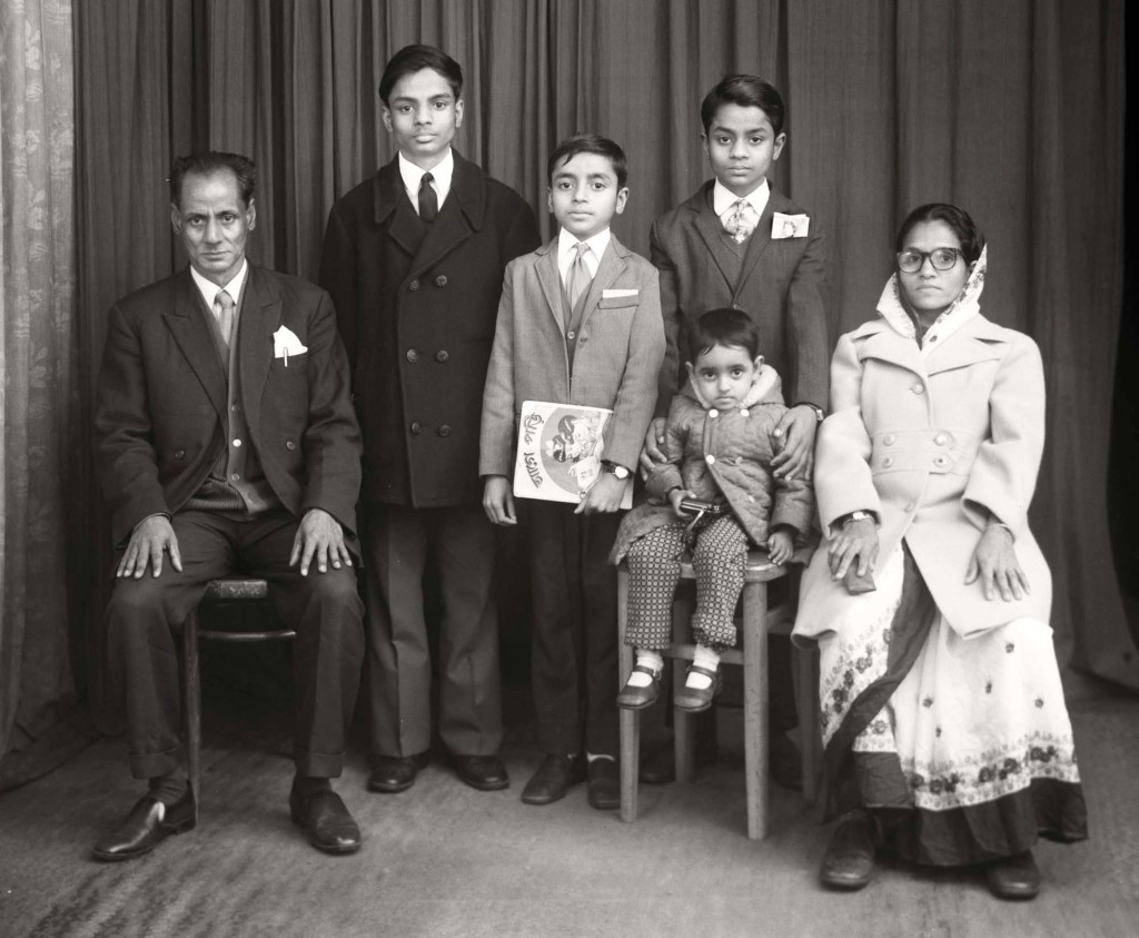 A Bradford Bangladeshi family at the Belle Vue Studio, also known as Sanford Taylor's, who was its original owner. This high street portrait studio on Manningham Lane in Bradford had many customers who moved to the city to seek work during the 1940s, 50s and 60s. It became very popular amongst newly arrived Asian men, who wanted photographs to send home and who were later joined by their wives and children.