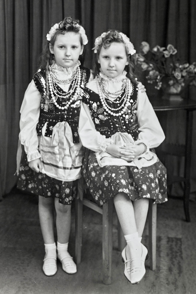 Twin sisters in Polish traditional dress during the 1950s. Photograph taken at the Belle Vue Studio, also known as Sanford Taylor's, who was its original owner. This high street portrait studio on Manningham Lane in Bradford had many customers who moved to the city to seek work during the 1940s, 50s and 60s.