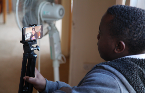 Young people film each other at Norwich International Youth Project